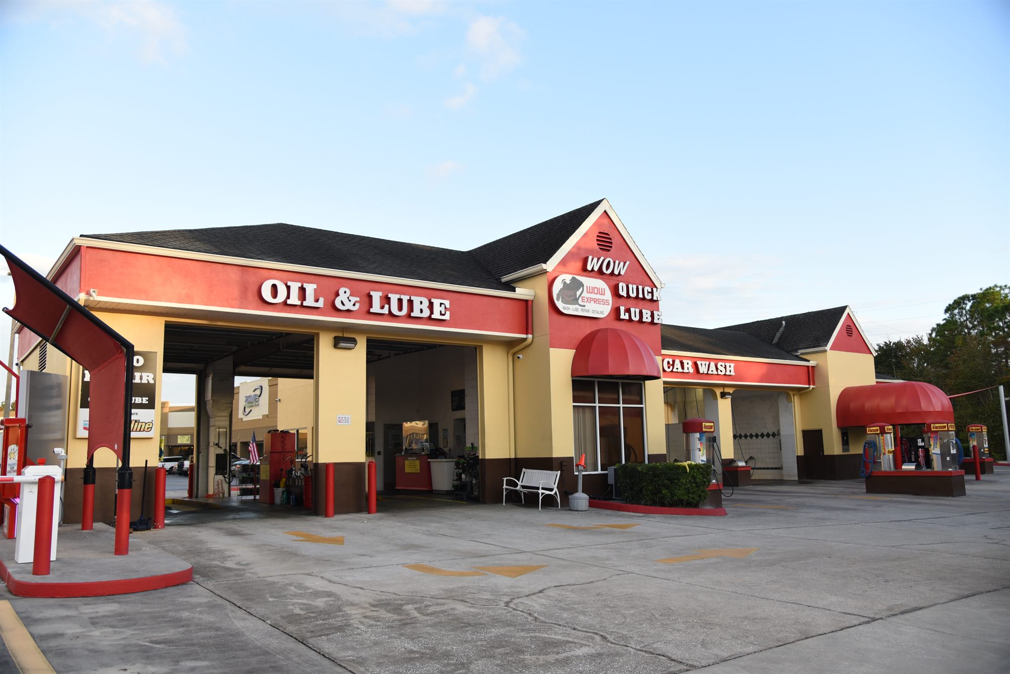 The Wow Express building on Seven Springs Blvd — Oil & Lube bays, Wow Quick Lube tower, and Car Wash tunnel